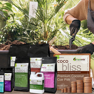 All natural and organic coco coir fertilizers and neem oil on table with women potting a plant