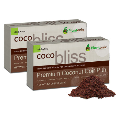 Two boxes of 650g Coco Bliss. The boxes are in an offset line. There is a small pile of the coco coir in front of both boxes. The boxes are tan on top and brown on bottom. They read "Organic Plantonix Coco Bliss. Premium Coconut Coir Pith. Net WT. 1.4lB(650g).