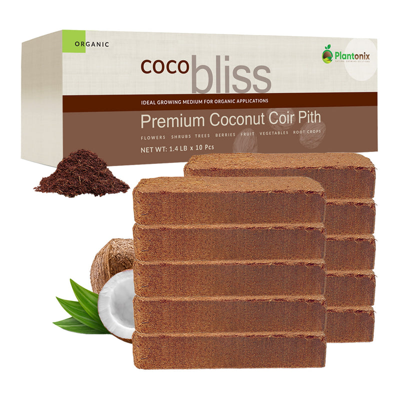 Two stacks of coco coir blocks in front of a premium coco coir pith box. There is a coconut next to the blocks and a loose pile of coco to show texture. 